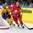 MINSK, BELARUS - MAY 22: Kirill Gotovets #91 of Belarus skates with the puck while Sweden's Mikael Backlund #60 chases him down during quarterfinal round action at the 2014 IIHF Ice Hockey World Championship. (Photo by Andre Ringuette/HHOF-IIHF Images)